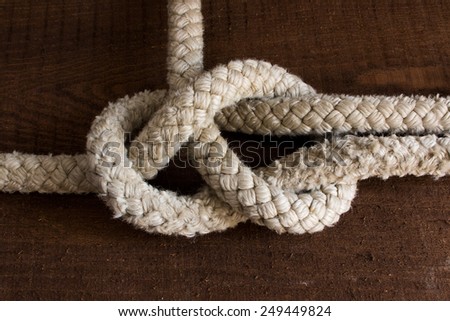 Nautical knots photographed on a wooden
