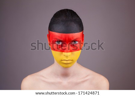 woman with painted germany flag on face