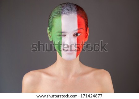 woman with painted italy flag on face