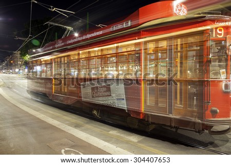 MILAN, ITALY JULY 21: summer night view of a typical public tram in Milan city. Long exposure with blurred motion panning. Milan, July 21, 2015.