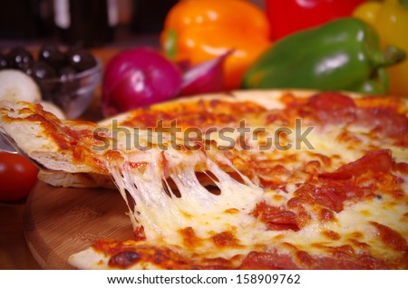 Hot Pizza Slice Being Served A Slice Of Pizza Being Served With The Cheese Stretching