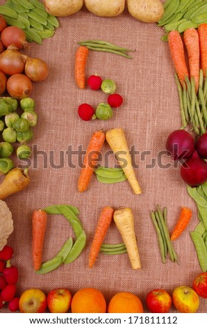 Five A Day Fruit and Vegetables Fresh vegetables and fruit laid out to show the healthy eating message of 5 a day