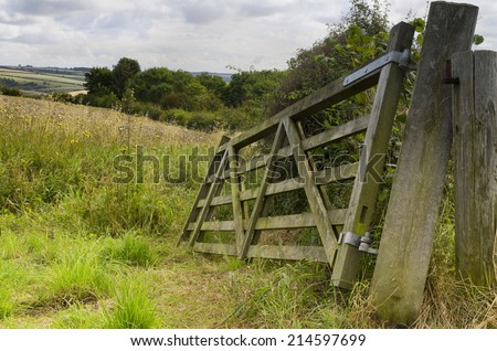 Broken Field Gate, Brubberdale, East Yorkshire  A broken field gate next to the old fence post overlooking a meadow with wildflowers near Brubberdale, East Yorkshire