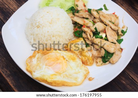 fried basil chicken with fried egg and rice, top view