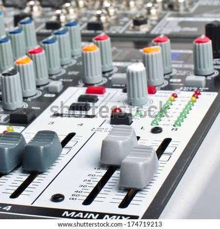 Audio mixer desk controls closeup