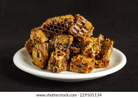 Pile of bee pollen or bee bread on the black background
