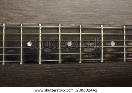 Acoustic guitar frets close up