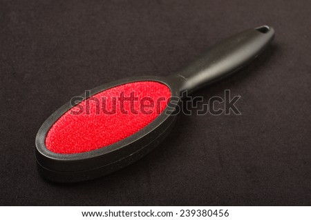 Lint remover brush isolated on the black background