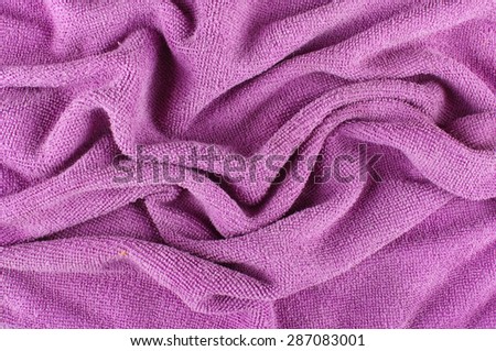 Purple microfiber cleaning cloth wrinkles abstract surface pattern