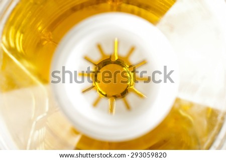 Abstract photography of inside plastic sunflower oil bottle focus on oil