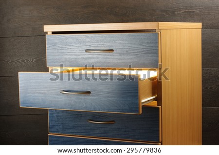 Mystery concept light from open drawer