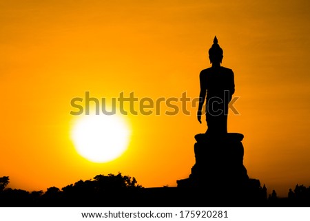 silhouette of Buddha statue sun