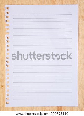 checked note paper on wood