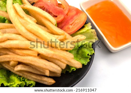 French fries with ketchup closeup over white, potato, fast food