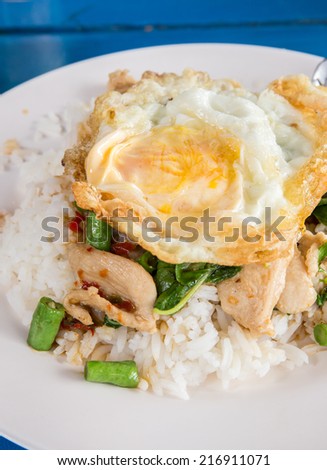 fried basil chicken with fried egg and rice, Thai popular food menu