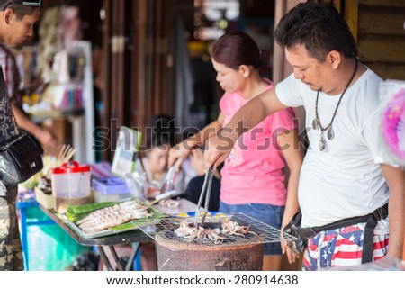 AMPHAWA,THAILAND-DE May 10 An unidentified street vendor prepares food in the Amphawa Floating Market on May 10, 2015 in Amphawa, Thailand.