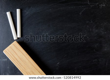 close up of a black dirty chalkboard, education and back to school concept