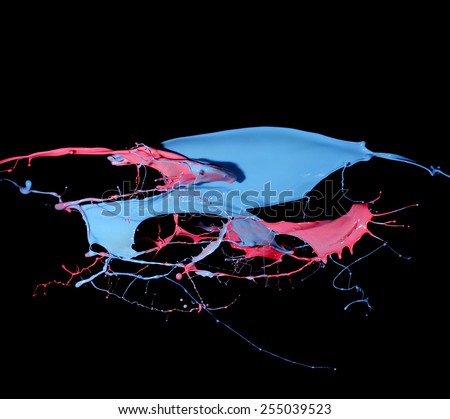 Splashes of blue and red paint isolated on black background
