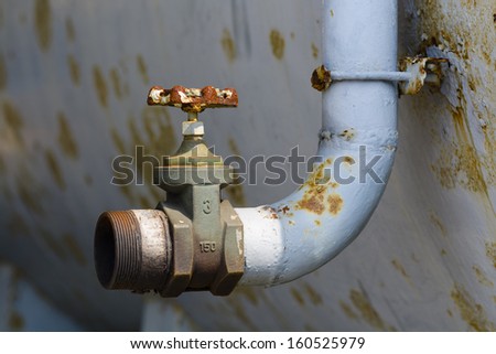 Rusty pipe and valve.