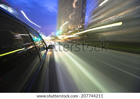 Night drive with car in motion.