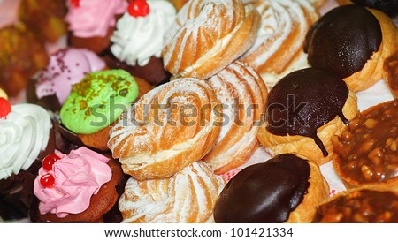 Different types of cakes, placed along rows.