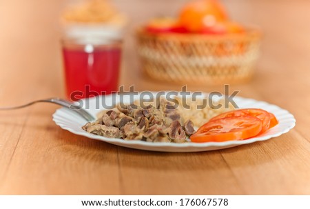 pasta, braised meat, sliced Ã?Â¢??Ã?Â¢??tomatoes, glass juice, apples vase background wooden table