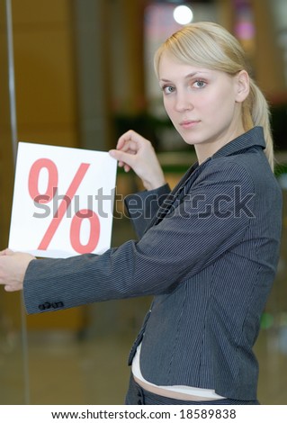 Young the seller shows, that in shop seasonal discounts