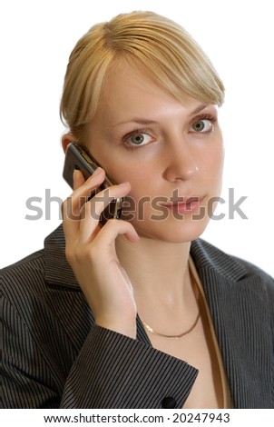 The young beautiful woman holds in hands a cellular telephone on a white background