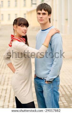 Girl has put hand on shoulder to friend.