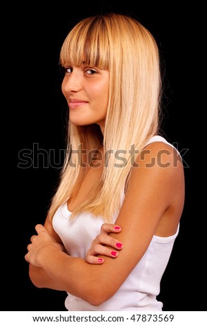 Portrait of charming girl in white vest, it is isolated on black background.