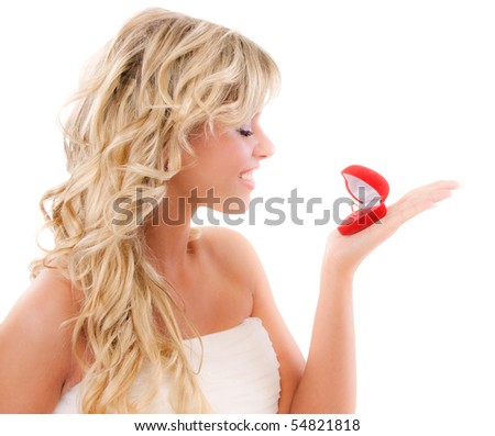 stock photo Girl with surprise looks at box with wedding ring 