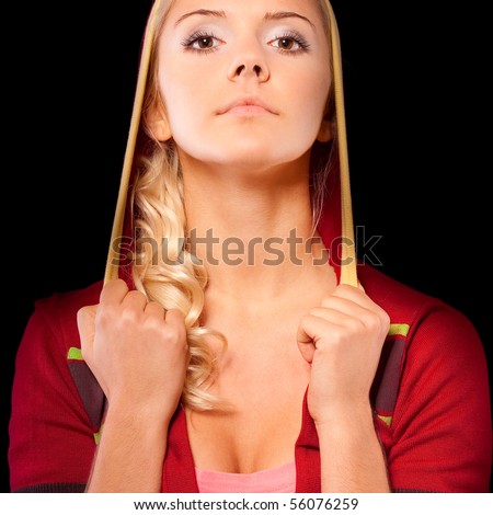 Nice young woman in red hood, it is isolated on black background.