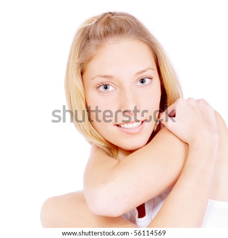 Beautiful girl in light vest holds hands on shoulder, isolated on white background.