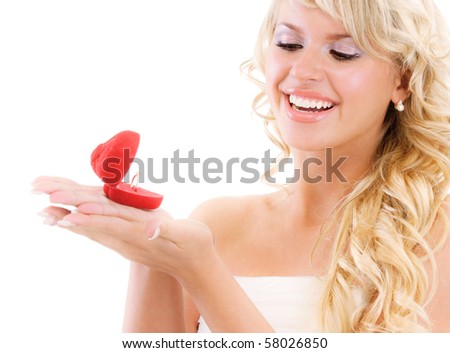 stock photo Girl with surprise looks at box with wedding ring