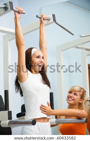 portrait of girl and her trainer working out on VKR