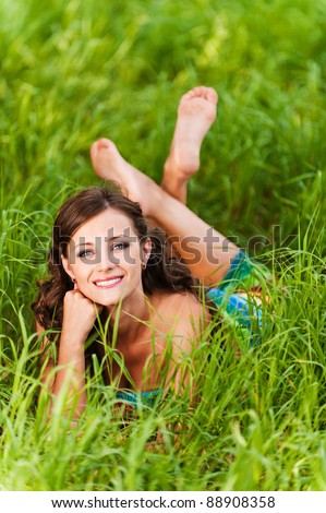 beautiful young woman smiling lying green grass background summer green meadow