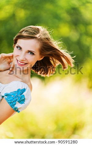 portrait young cheerful woman shorthair peeps background summer green park
