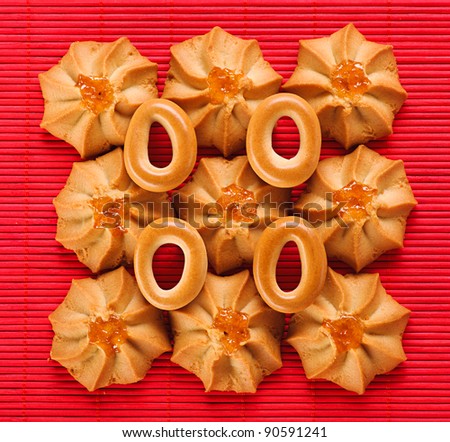 against background of pink bamboo cloth is crunchy biscuits with bagels