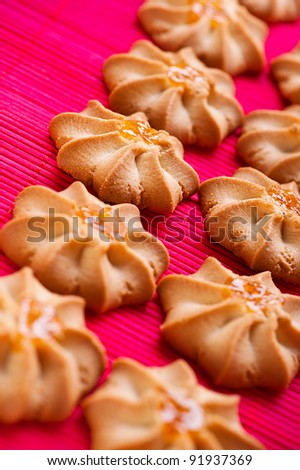 against background of pink bamboo cloth is crunchy biscuits