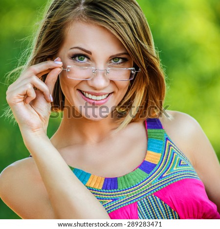 attractive woman pink dress glasses summer park