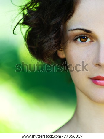 Portrait half of beautiful polish girl close up on green background.