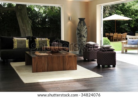 Lounge or garden room with Javanese influences from the inside with garden beyond