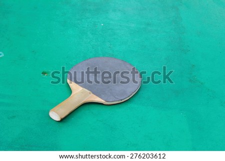 the table for table tennis racket lies