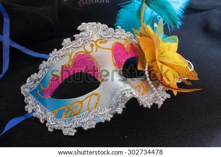 interesting masquerade mask with decoration on a black background
