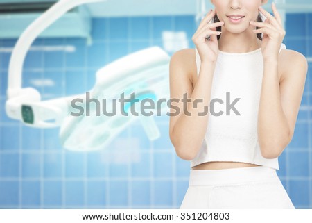 woman in surgery room on surgical background for bueauty surgery