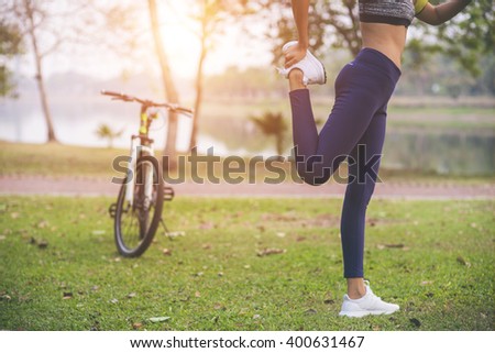young woman, exercise in gardent background