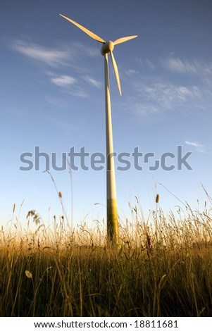 wind farm turbine generators rows at dusk