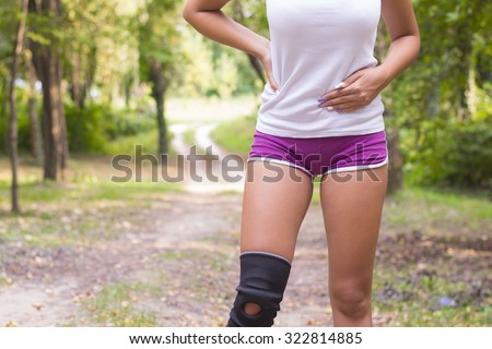 Side stitch - woman runner side cramps after running. Jogging woman with stomach side pain after jogging