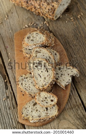 Slices of grain bread on wood table. Shallow depth of field.