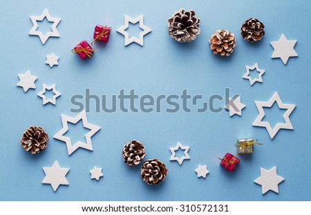 Christmas decoration background over blue background, above view with copy space for text or other design